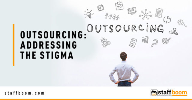Man Facing Wall with Outsourcing Text - Banner Image for Outsourcing: Addressing The Stigma Blog